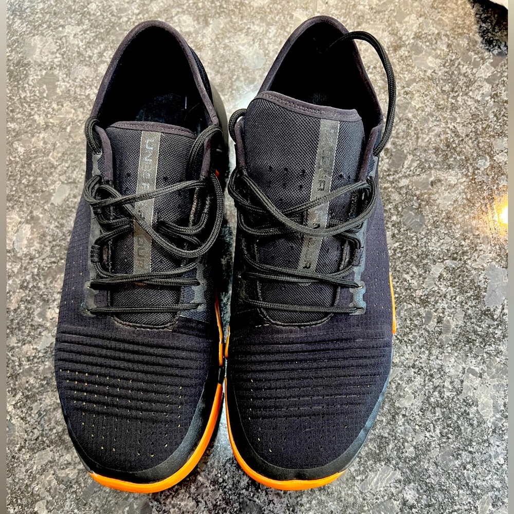 Black and tan Under Armour training shoes. Hardly worn, 11 1/2.